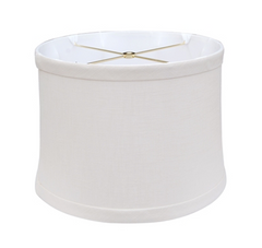 A white drum-shaped lampshade with a small metal cross structure inside.
