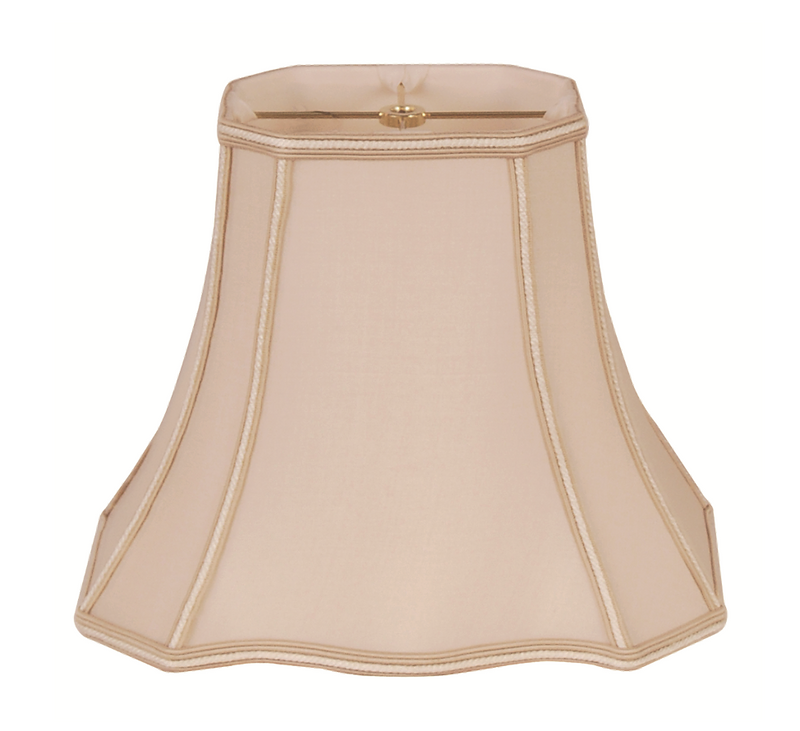 A beige lampshade with a clover rectangle bell shape and braided trim.
