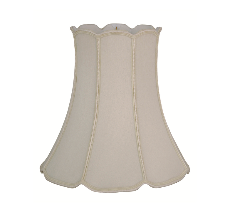 A beige V-Notch Drum lampshade with braided trim.