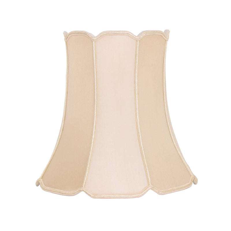 Beige scalloped lampshade on a white background