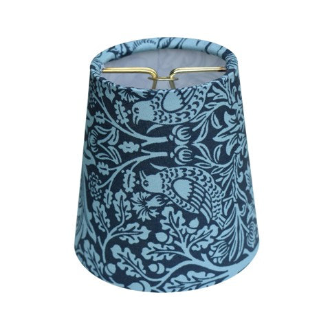 Blue floral patterned lampshade on a white background